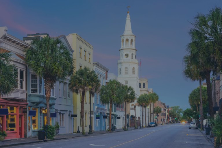 A long, streetside view of the beautifully restored, colorful, and quaint vintage buildings, lining this downtown street of Charleston, South Carolina, a location of FamilyLife's Weekend to Remember® marriage retreat event.