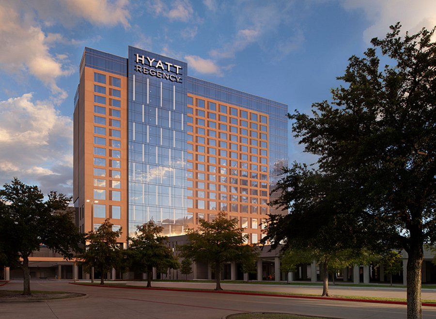 A streetside view looking up to see the Hyatt Regency hotel in Frisco, Texas, a location for FamilyLife's Weekend to Remember® marriage retreat event
