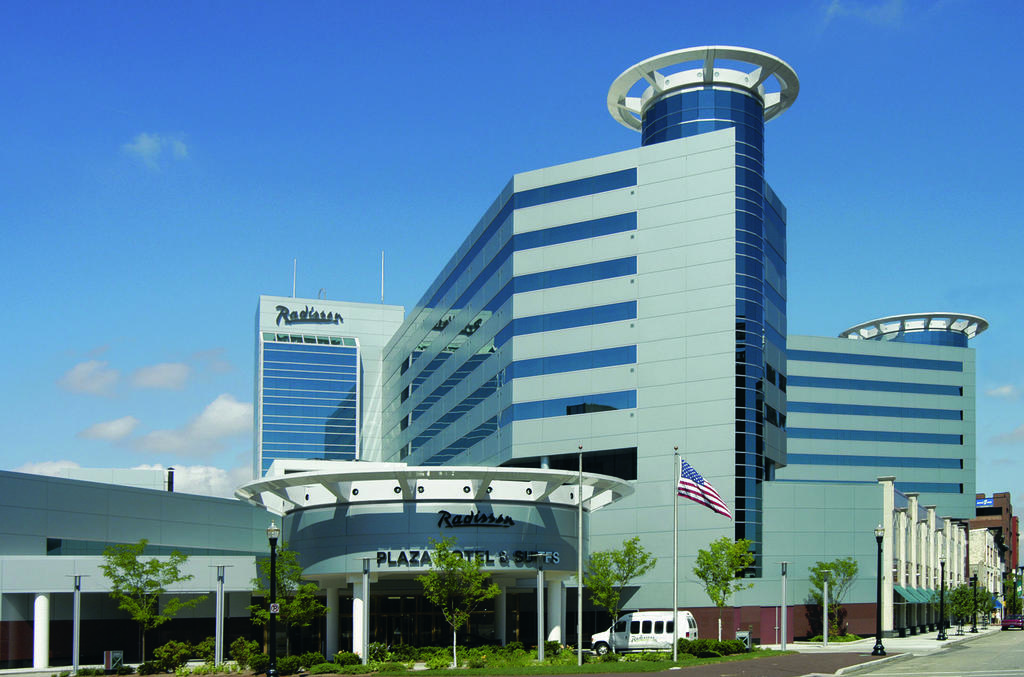 A street view looking up at the Kalamazoo Radisson hotel in Kalamazoo, Michigan, a location of FamilyLife's Weekend to Remember® marriage retreat event