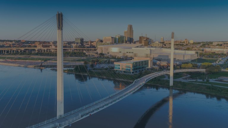 A view over the iconic Bob Kerrey Pedestrian Bridge, a 3,000-foot cable-stayed bridge, which spans the Missouri River and leads to the city of Omaha, Nebraska, a location of FamilyLife's Weekend to Remember® marriage retreat event.