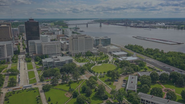 View of the Baton Rouge downtown riverside area with a manicured park and walking trails in the city of Baton Rouge, Louisiana, a location of a Weekend to Remember® marriage retreat event.
