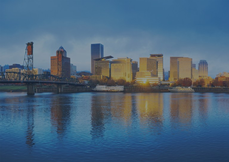 A tranquil waterside cityscape and skyline view at sunrise of Portland, Maine, a location of FamilyLife's Weekend to Remember® marriage retreat event.